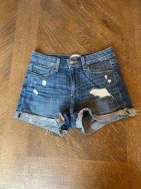 PAIGE Medium Wash Distressed Denim Shorts